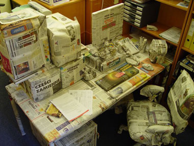 all office items wrapped in newspaper