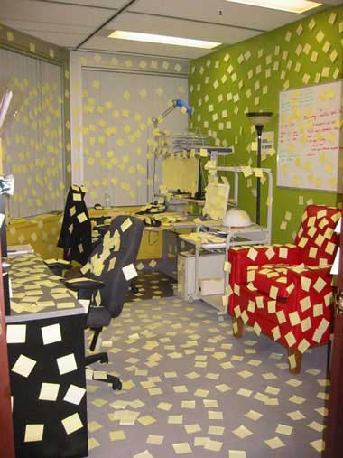 office covered with post it notes