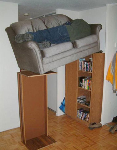 man on sofa sofa on cupboard
